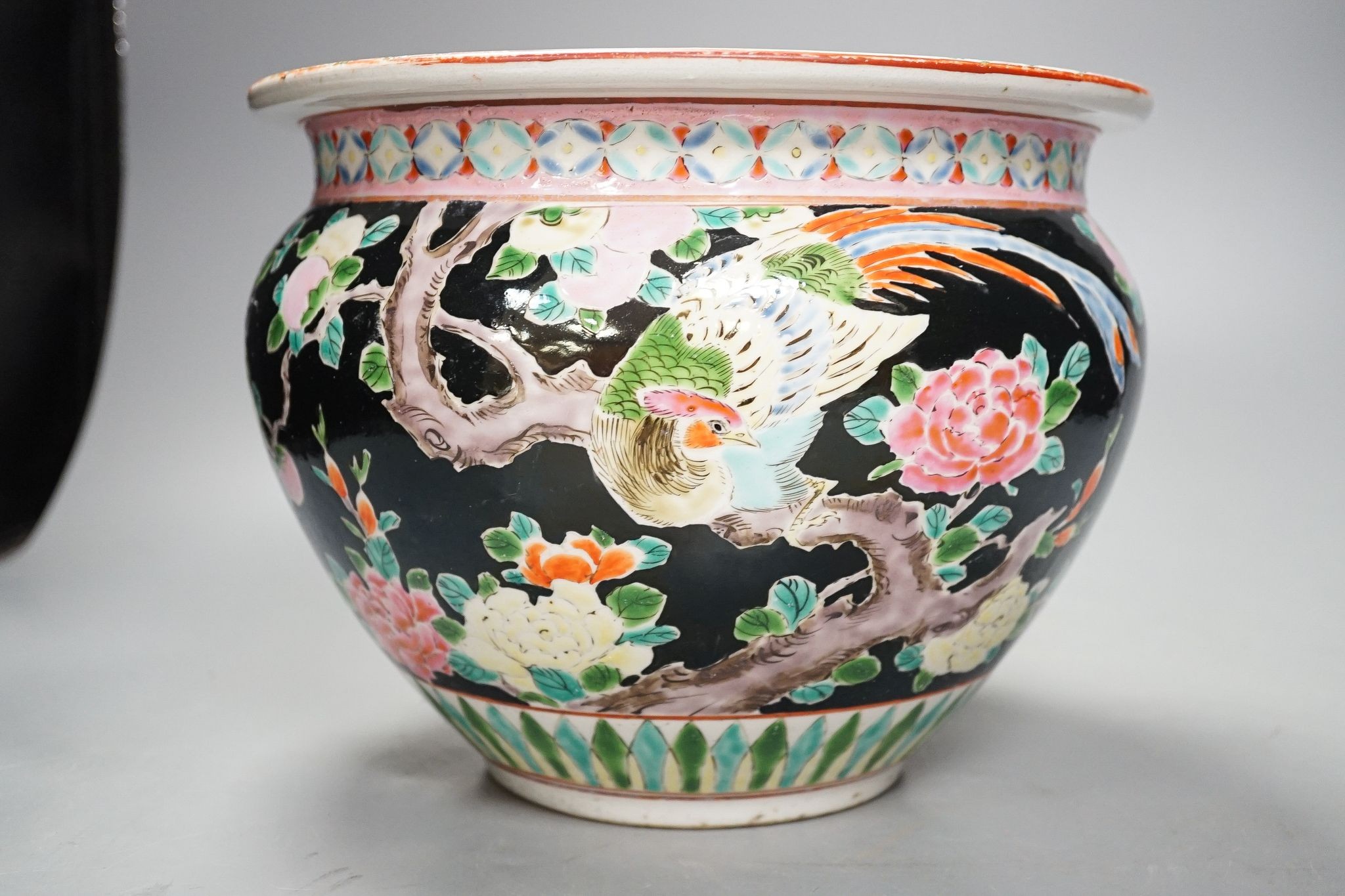 Three late 19th century Japanese porcelain dishes and a jardiniere, 19 cms high.